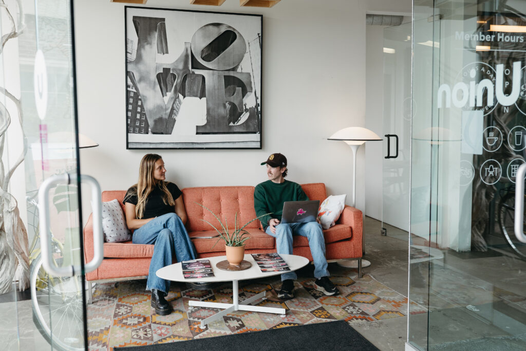 Members networking and connecting at a coworking community event in North Park San Diego